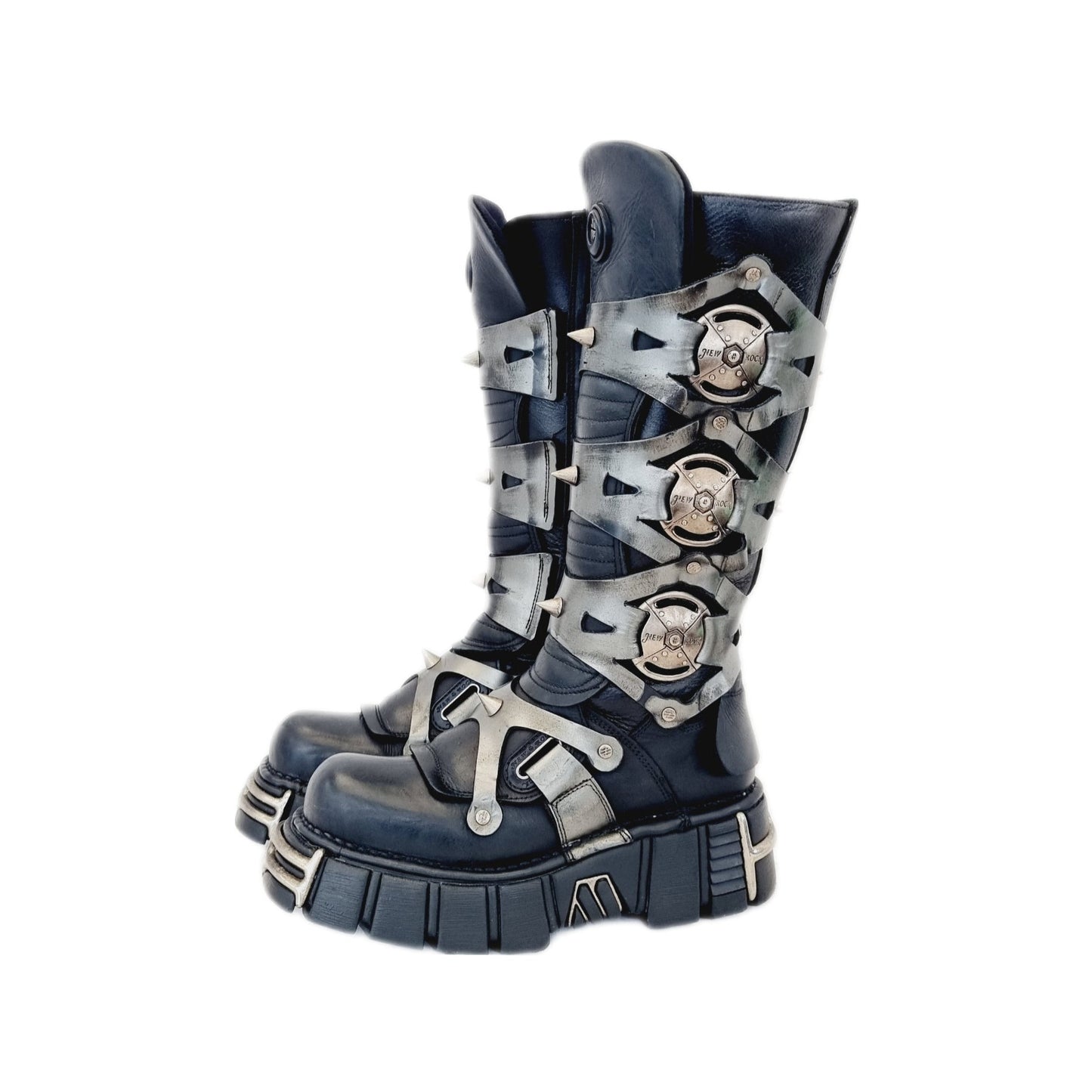 Vintage leather and chrome metal New Rock boots with leather straps, studded spikes and armour like side pieces. These tower boots are black and silver in colour and sit just just above the mid calf / below the knee.