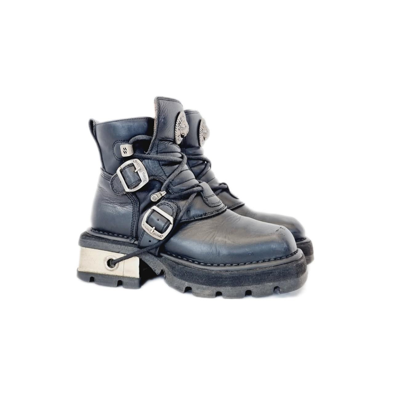 Black leather and silver metal New Rock boots with buckled straps and small heels. Must have addition to the collection of anyone who loves their unique chunky boots. Unlike many New Rocks they're not overly heavy as they're only ankle boots.
