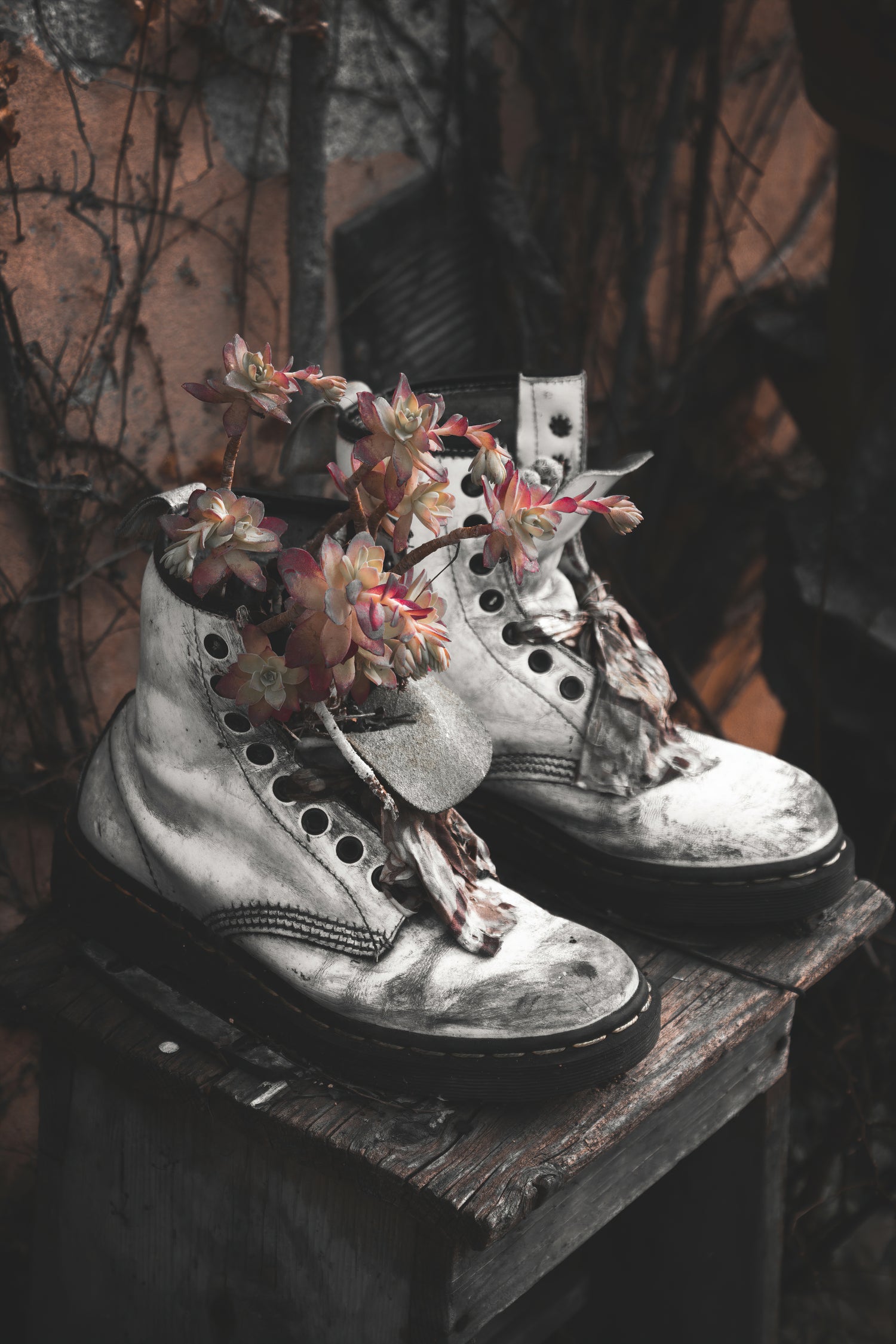 Battered lace up Grunge Boots overflowing with Autumnal plants and flowers