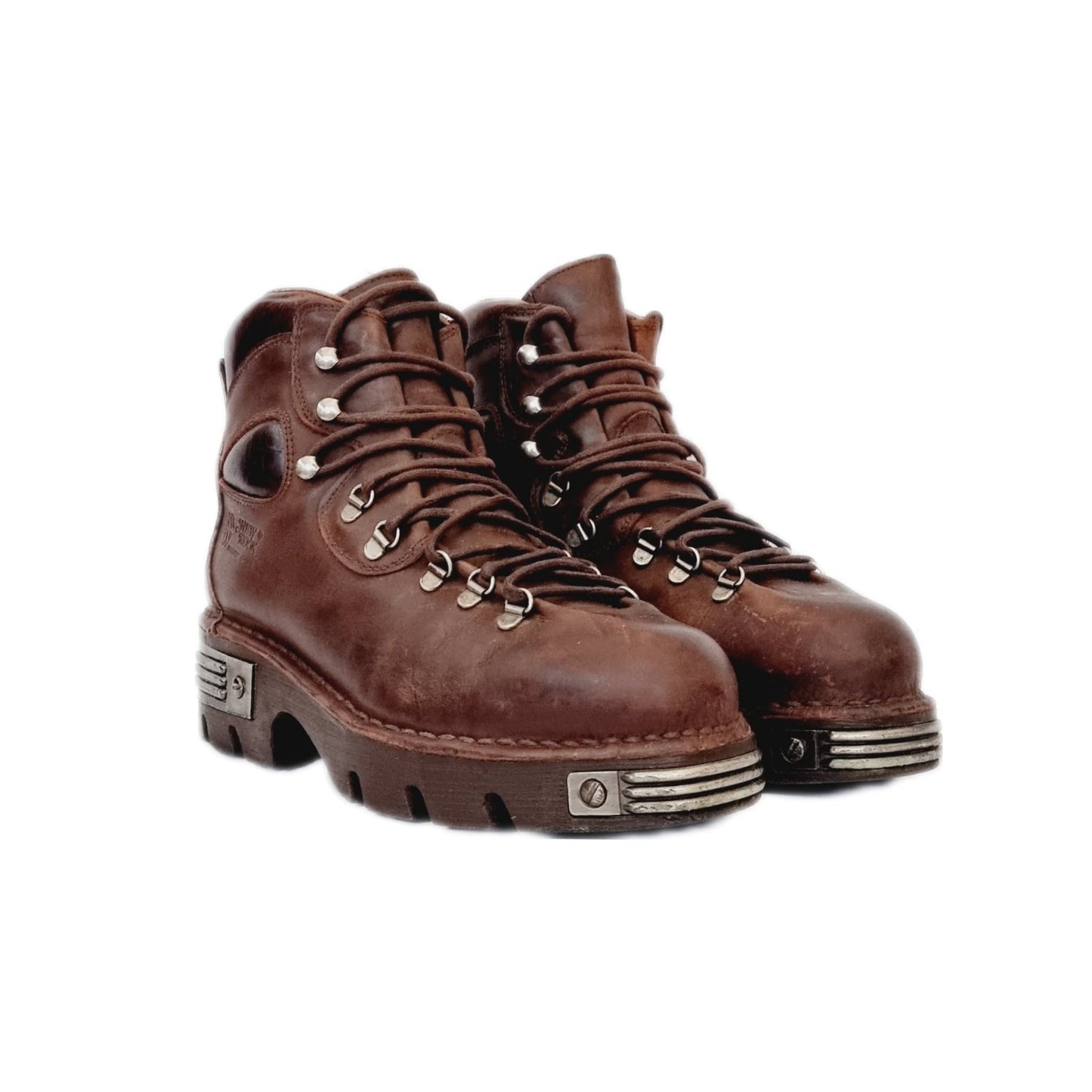 Rare vintage leather and metal brown New Rock boots with lace up fronts + decorative bolts and rivets, and chunky metal adorned soles with a really unique steampunk twist...super sturdy, they're chunky but they don't have really huge platforms. Rather than a full-on platform, the sole is a couple of inches, made of high quality anti aquaplaning rubber from the 90s / y2k era - the golden age when chunky boots reigned supreme!