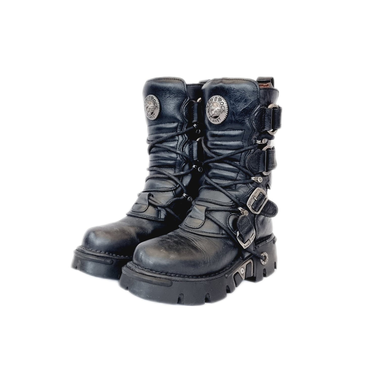 Leather and metal New Rock boots with lace up fronts and Velcro straps. These tower boots are black in colour and sit a little above the mid calf. The buckles and laces are fully adjustable from the inside and outside of the boot. Like most New Rocks these have chunky platforms, but they aren't so big they can't be used daily. Rather than a full-on platform, the sole is a couple of inches, made of high quality anti aquaplaning rubber from the 90s / y2k era
