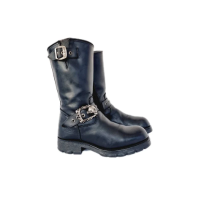 Black leather and silver metal buckled New Rock leather boots with buckled straps featuring skull emblems and an embroidered cross. Black, grey and silver, they sit about half way up the calf. Like most New Rocks these have chunky platforms, but they aren't so big they can't be used daily. Rather than a full-on platform, the sole is a couple of inches, made of high quality anti aquaplaning rubber from the 90s / y2k era - the golden age when chunky boots reigned supreme!