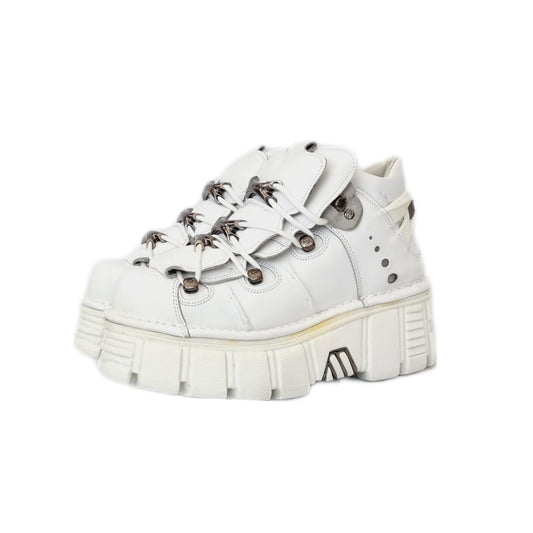 White leather silver metal and bold white rubber sole New Rock tower boots with lace up fronts and huge platforms. The platform is pretty lightweight as they go and made of a high quality anti aqua planing rubber.